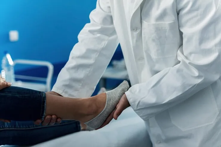 Close-up of podiatric foot assessment for custom shoe orthotics at Precision Podiatry in Alma, MI