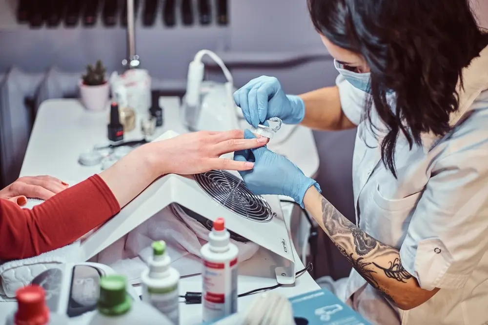 Specialist performing therapeutic nail and foot care service at Precision Podiatry in Alma, MI